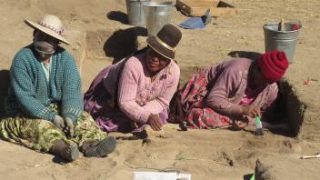 And back to excavating. Rosa, Maria, and Lydia carefully excavate a feature with animal bones.