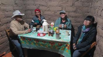 Bill, Dani, Bryna, and Jenny enjoy tea in the Totorani field house after a day of excavation.