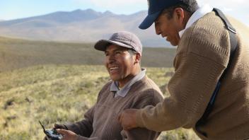 Javier and Albino learn to fly the drone at Chaccu Ccoypani.