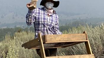 Mikayla braves the smoke with her N95 mask and collects samples.