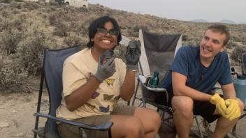 Parinita shows Buddy the basics of flintknapping. He is a quick learner!
