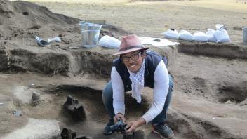 We use 3D photogrammetry to map the features in great detail. Greg take photos of a roasting pit for a 3D model.