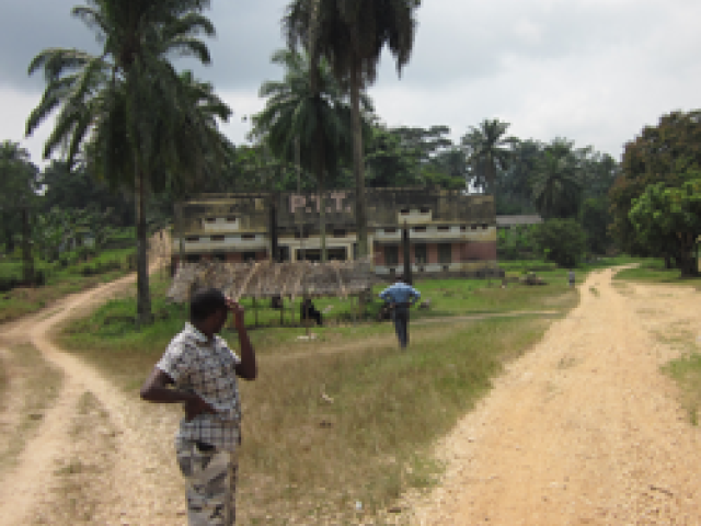 Human Behavioral Ecology - person standing in field/dirt road