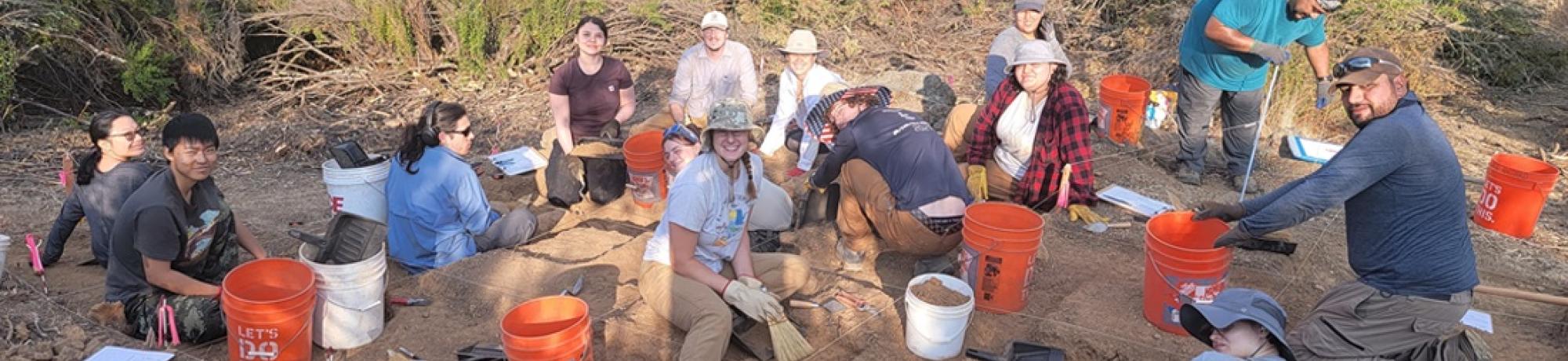 students digging in the dirt
